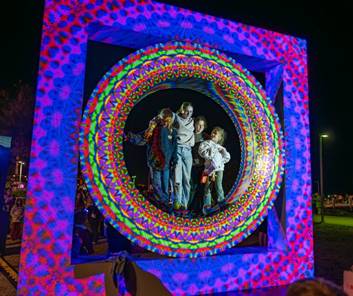 A group of people standing in a colorful circle with Venkateswara Temple, Tirumala in the background

AI-generated content may be incorrect.